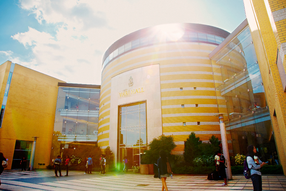 Outside shot of Vari Hall on a sunny day.