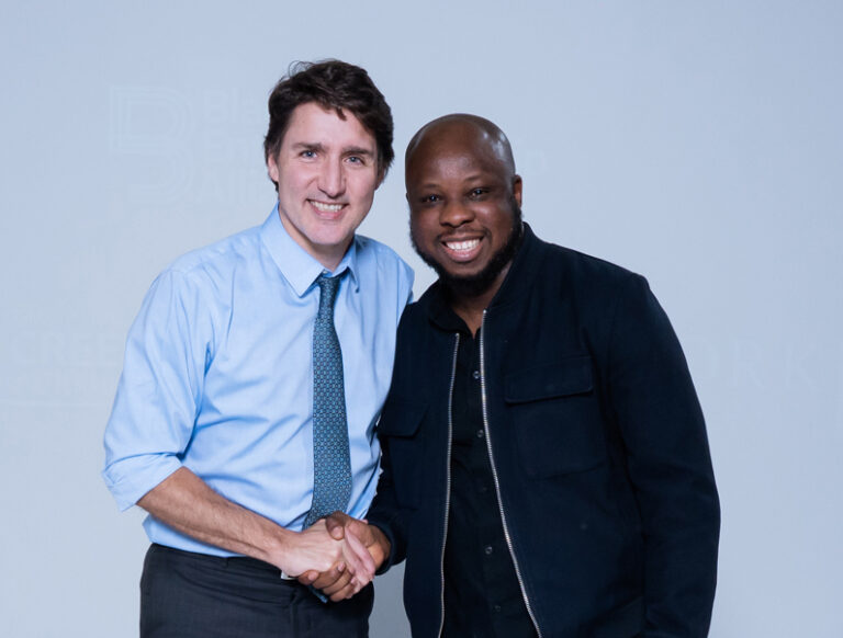 Prime Minister Trudeau and York entrepreneurs shaking hands.