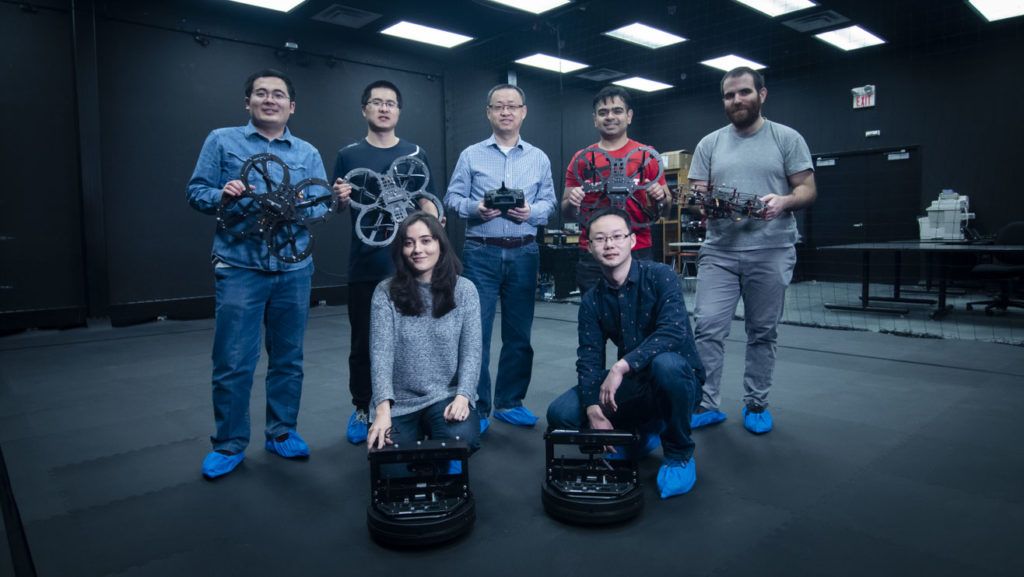 Professor Jinjun Shan with his graduate students in their York Research Facility for Autonomous Unmanned Vehicles.