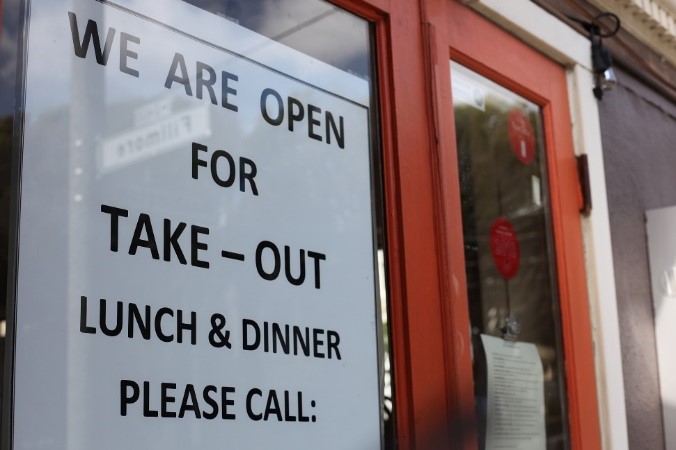 A paper sign on restaurant's window 