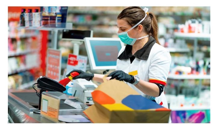 Cashier wearing mask.