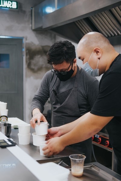 Two men working in a restaurant.