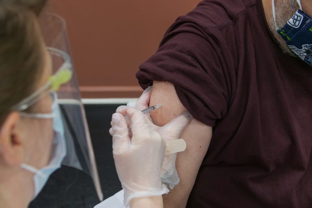 A person getting vaccine shot.