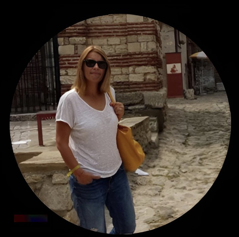 Portrait of Cristina Cismaru wearing jeans, a white t-shirt, sunglasses, and carrying a bag