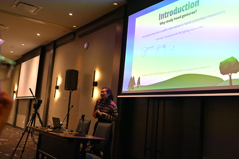 Phoebe presenting her work Heads Will Roll: Alternative Head Pointing for a Head-Mounted Display at SUI '25.