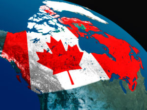 Geographic outline of Canada filled with the Canadian flag.