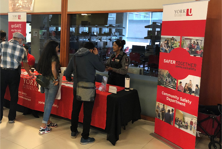 A York Security Official speaking to visitors at a information session