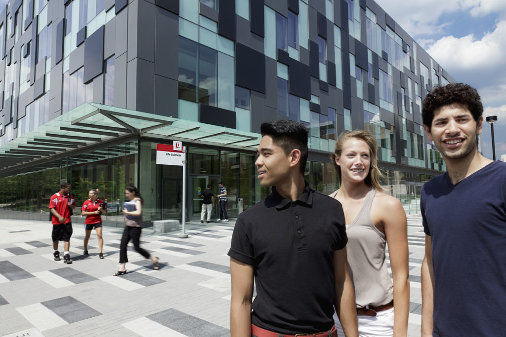 Students standing in front of the Life Sciences Building at York University