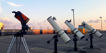 Four telescopes pointing towards the sky