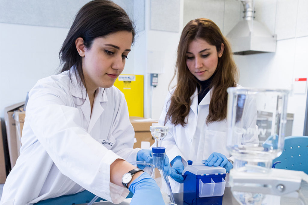 Two female students in the science lab.