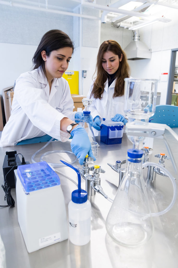 Female students in science lab.