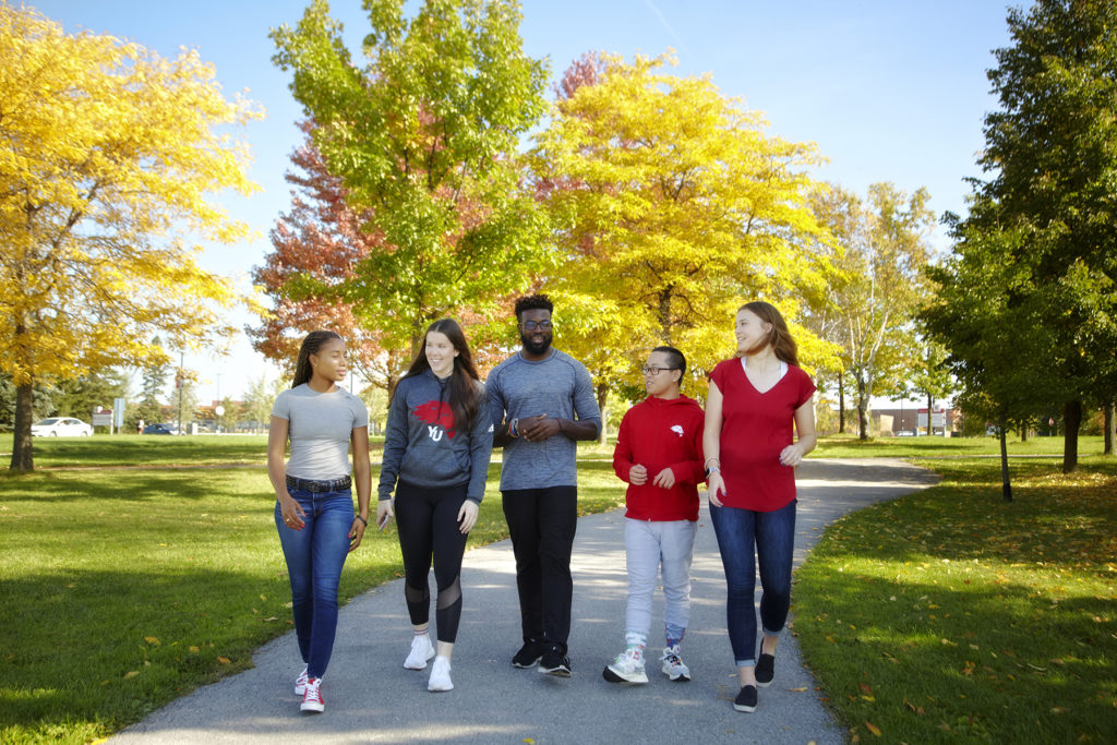 Students walking outside on campus.