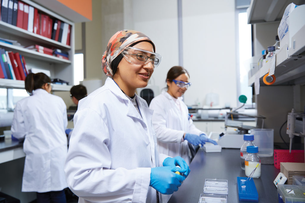 Female students in science lab.