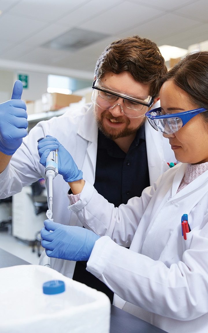 Two Science students in a lab