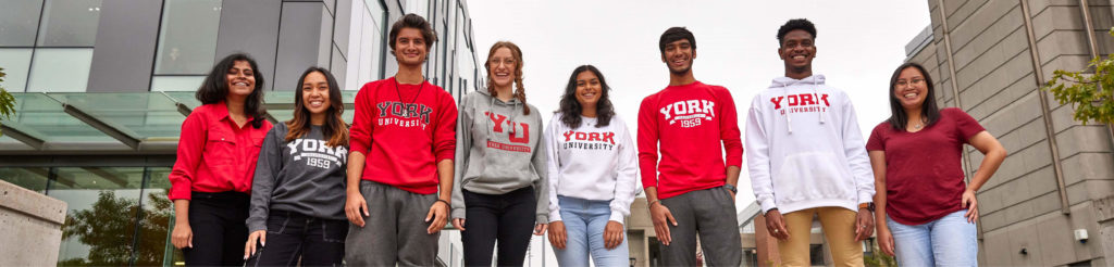 York University students standing in front of the Life Sciences Building