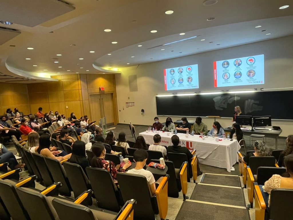 Prospective students and their families attending an alumni panel session at the Science Open House