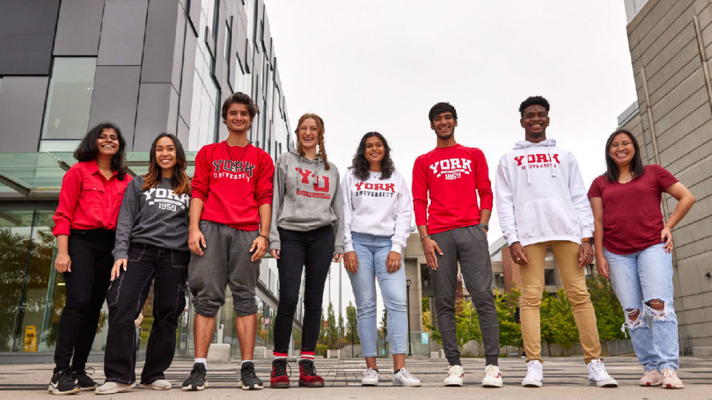 York University students standing in front of the Life Sciences Building