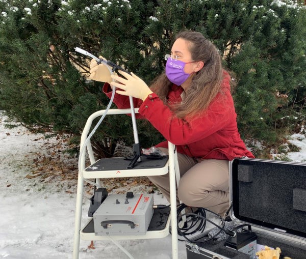 Clare collecting air samples for her research