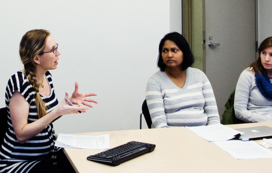 Teaching Assistant speaking with students