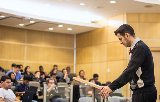 Faculty member teaching in a lecture hall
