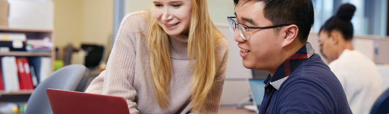 Two York students looking at a laptop