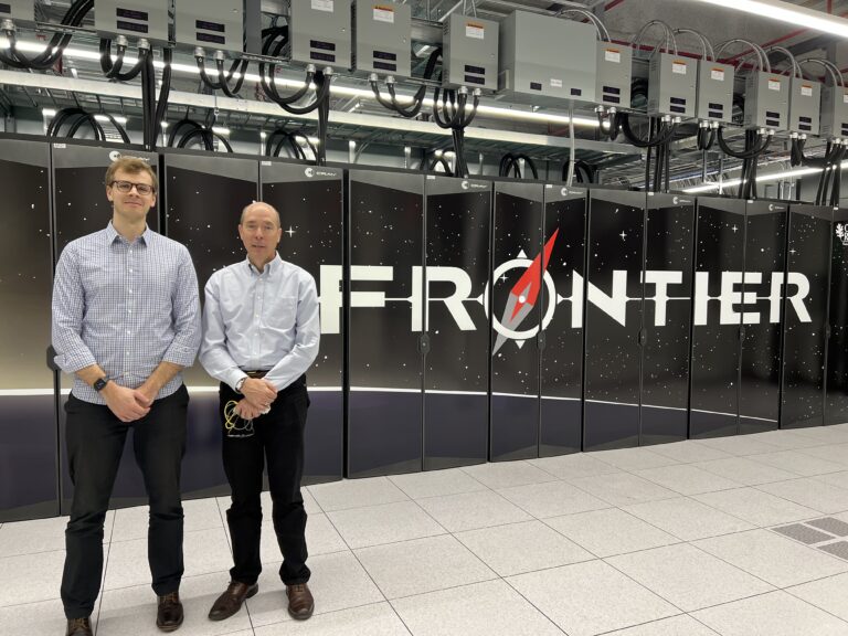 York University Assistant Professor Miles Couchman (left) and collaborator Professor Steve de Bruyn Kops (right) in front of the Frontier Supercomputer