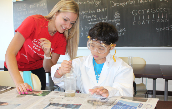 A Science Engagement Programs instructor teaching a student