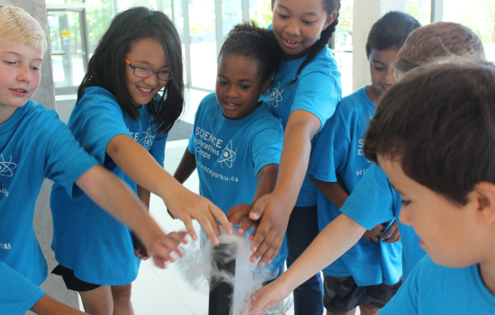 A group of students performing a science experiment