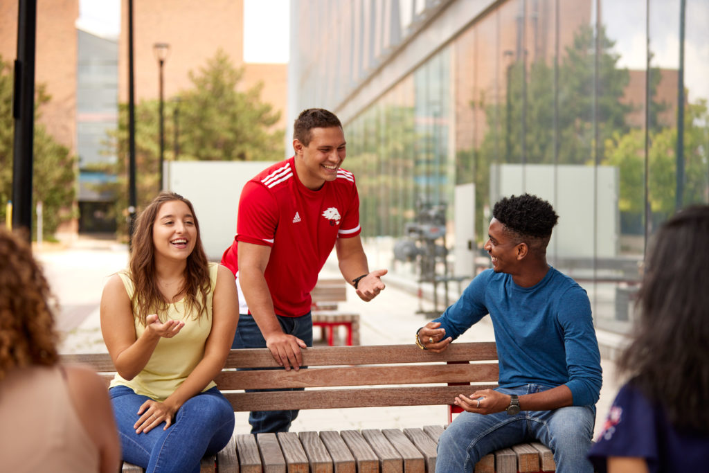 Three students in discussion outside the second student centre