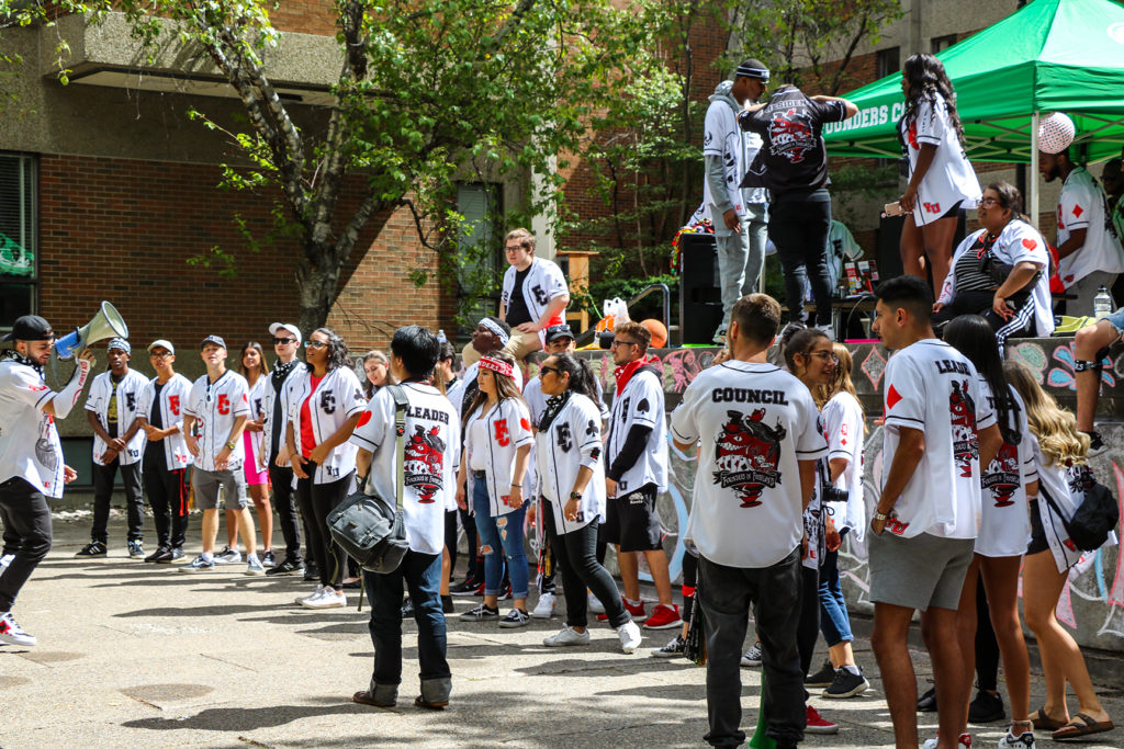 Lots of students helping others move in to residence on move-in day.