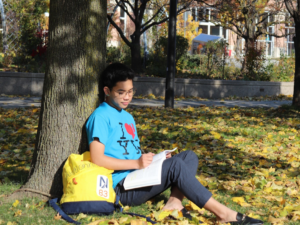 Student Studying Outdoors. 