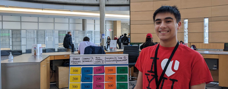 A Learning Skills Peer stands in Vari Hall, smiling.