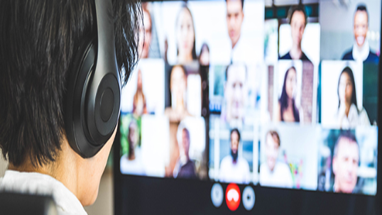 A person on a video call showing squares of people's profiles.