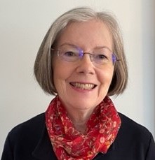 Closeup of the author in front of an off-white background