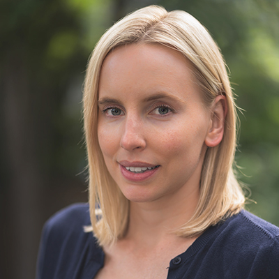 Stephanie Quail, a blonde woman with straight, shoulder-length hair, smiling into the camera