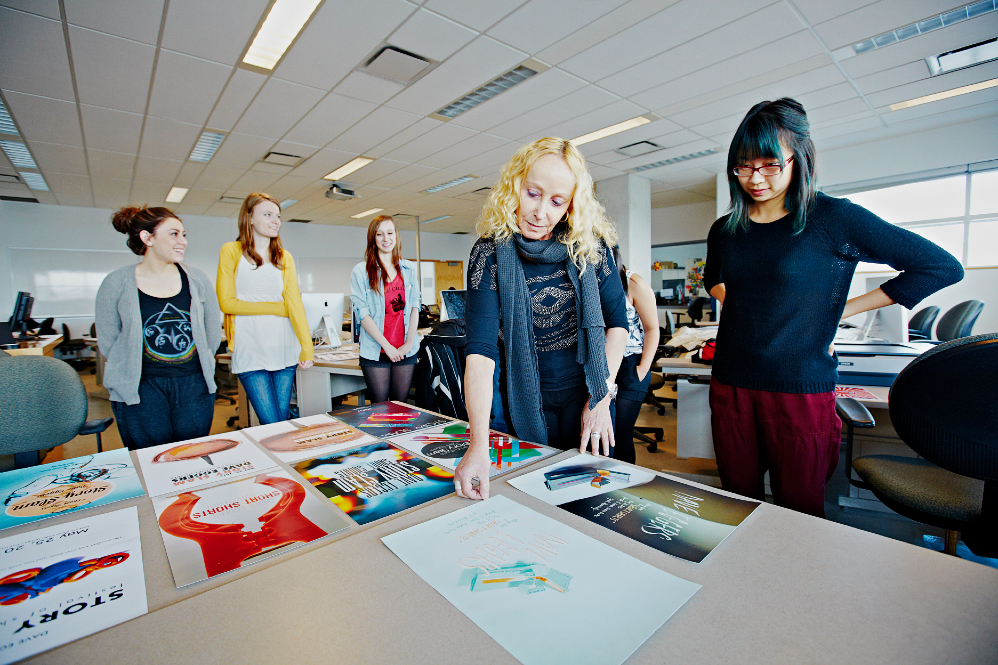 individuals organizing components of a portfolio or teaching dossier