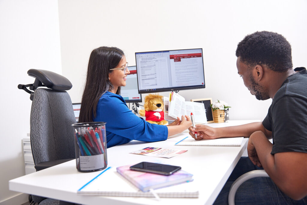 An instructor meeting with a student