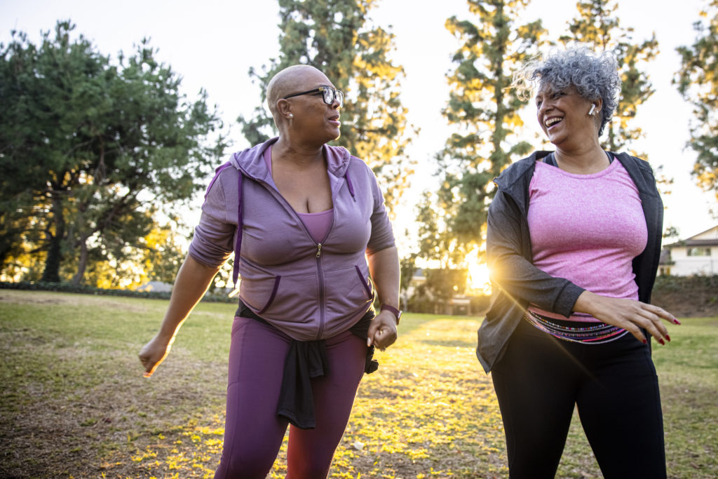 Two mature black woman together in nature.