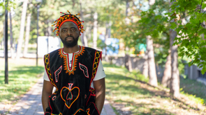 Black man wearing African outfit on York University campus
