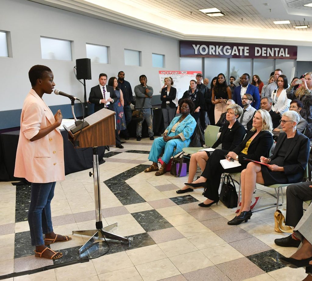 A black woman speaks at the Community Engagement Centre.