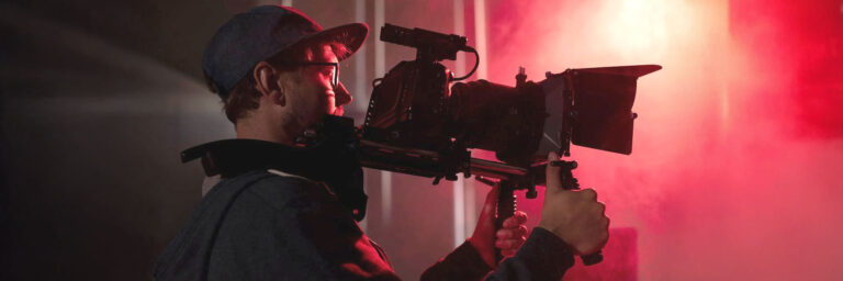 man filming with professional camera (1)