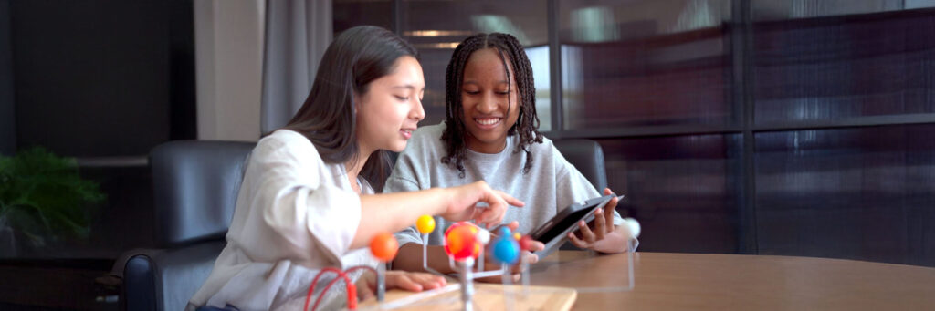 student enjoy learning and discussing about astronomy science together in classroom, a science student doing the astronomic projec
