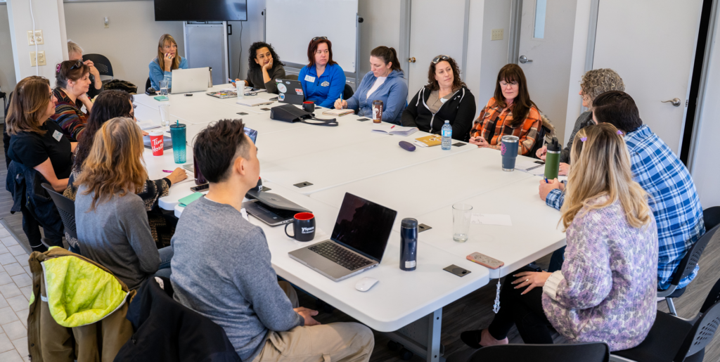 Entrepreneurs sitting around a table at the YSpace Georgina location.