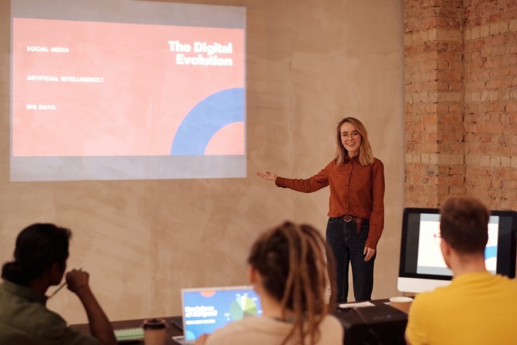 Woman presenting in front of people