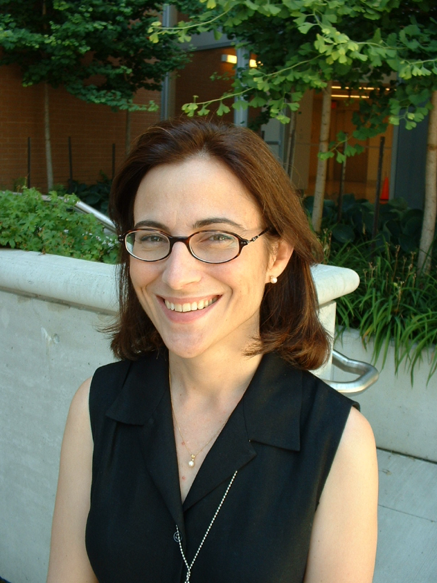 Dr. Mary Fox sitting outside smiling.