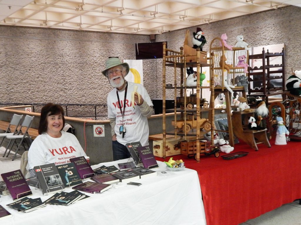 Image of 2 exhibitors (author of books and antique crafts) at Showcase 2018