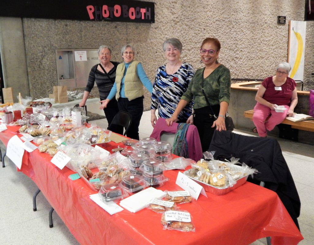 Four YURA volunteers staffing the Bake Table at 2018 Showcase